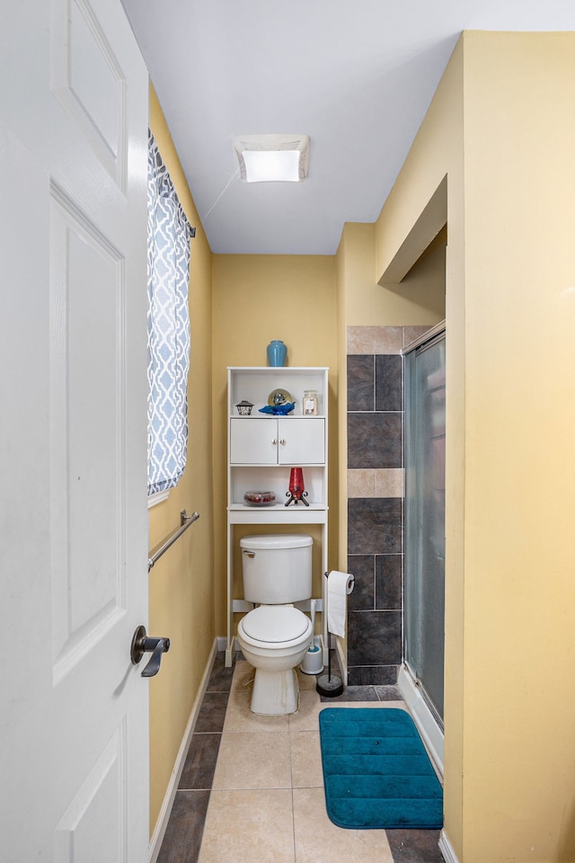 5184 Denwood St, Waterford, MI 48327 - full bath featuring baseboards, tile patterned floors, a shower stall, and toilet