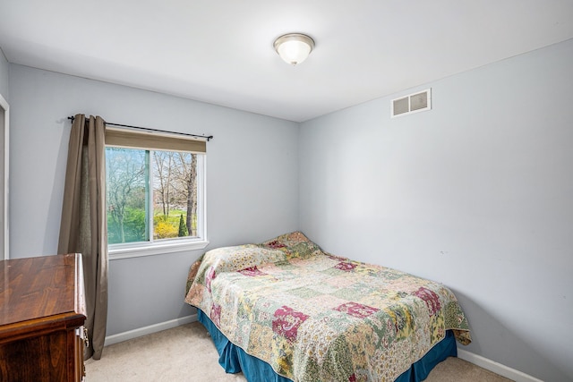 5184 Denwood St, Waterford, MI 48327 - bedroom with visible vents, baseboards, and light carpet