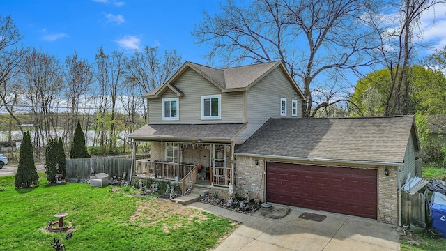 5184 Denwood St, Waterford, MI 48327 - traditional-style home with a shingled roof, brick siding, a garage, a front yard, and covered porch