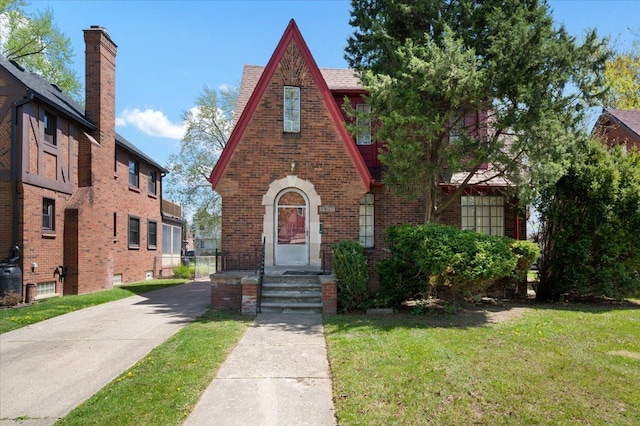 13936 Longacre St, Detroit, MI 48227 - tudor home featuring brick siding and a front yard