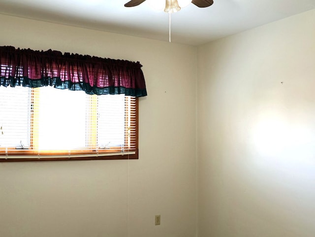 spare room featuring a ceiling fan