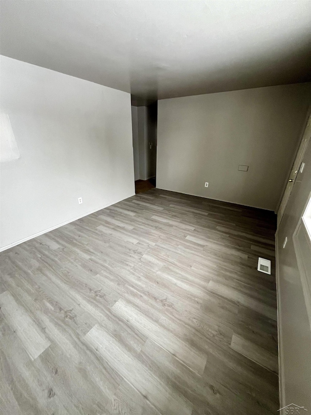 3704 Huntley St, Saginaw, MI 48601 - unfurnished room with wood finished floors and visible vents
