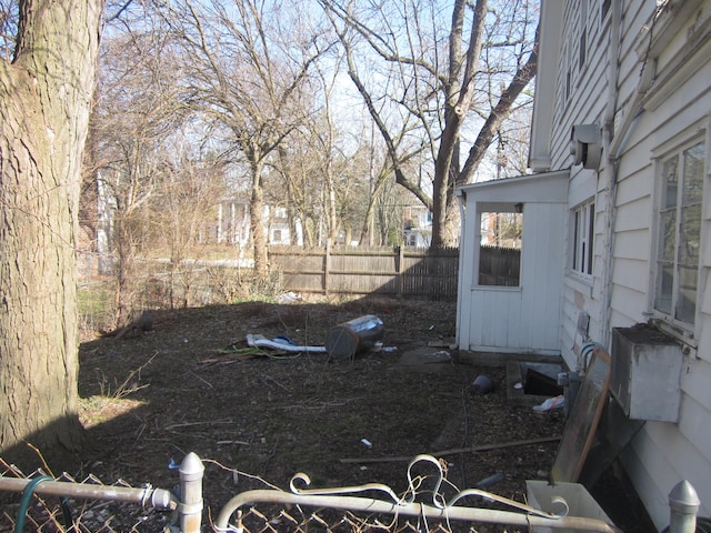 view of yard featuring fence and entry steps