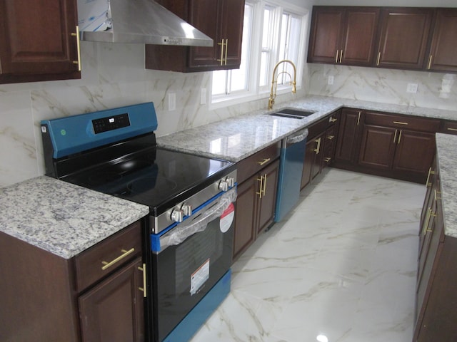 kitchen with under cabinet range hood, light stone countertops, a sink, marble finish floor, and stainless steel appliances