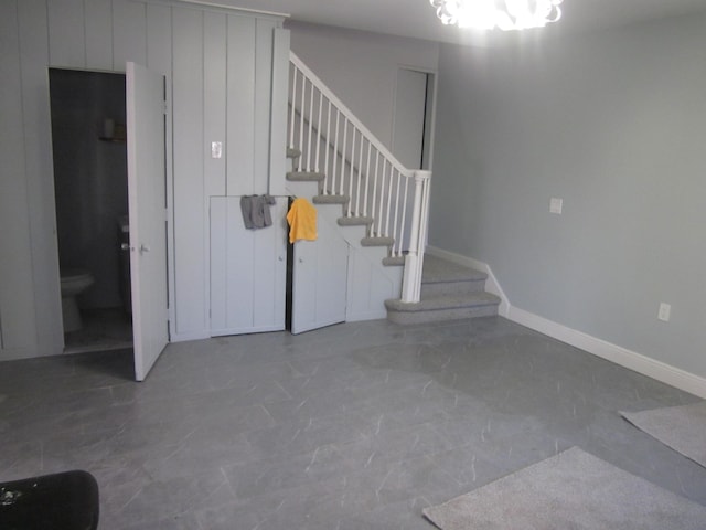 stairs with baseboards and marble finish floor