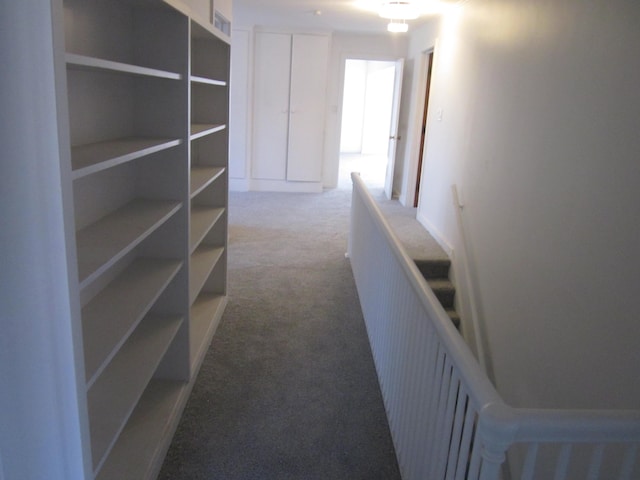 corridor featuring carpet flooring and visible vents