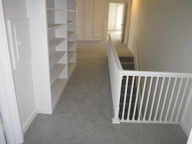 corridor with carpet flooring