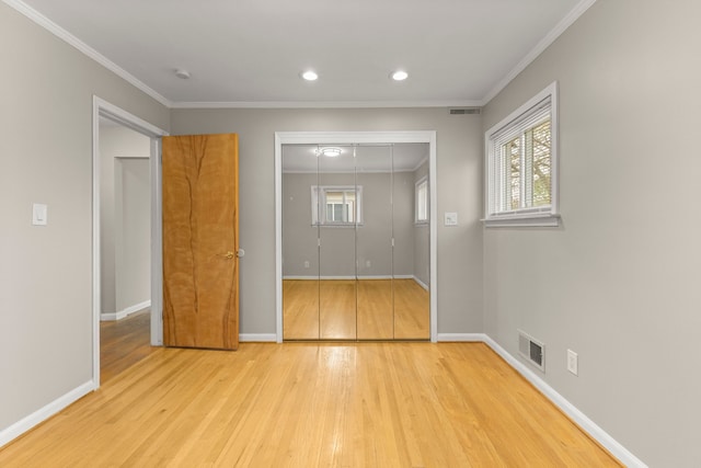 interior space with visible vents, crown molding, baseboards, recessed lighting, and light wood finished floors