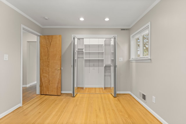 unfurnished bedroom with crown molding, recessed lighting, light wood-type flooring, and visible vents