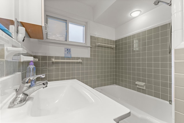 bathroom with  shower combination and a sink
