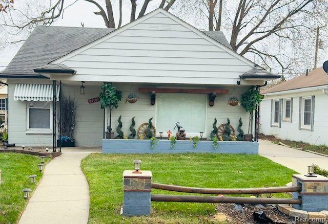 24101 Carlysle St, Dearborn, MI 48124 - view of front of house featuring roof with shingles and a porch