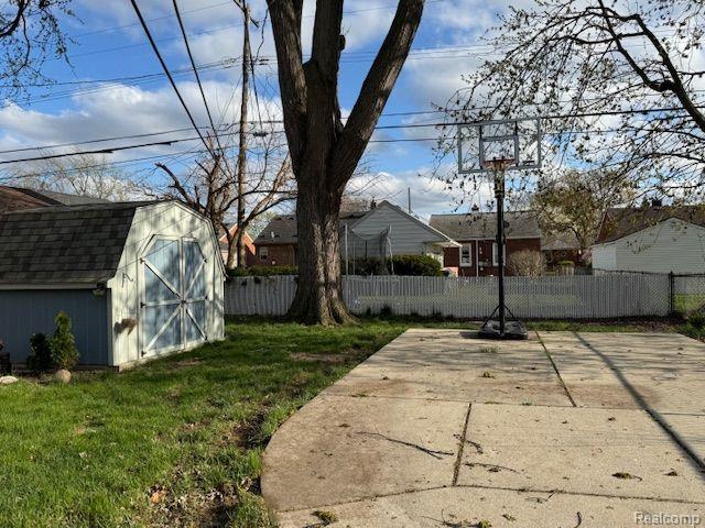 24101 Carlysle St, Dearborn, MI 48124 - view of yard with a shed and a patio area