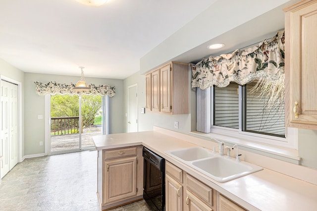 kitchen featuring a sink, light brown cabinetry, black dishwasher, and a peninsula