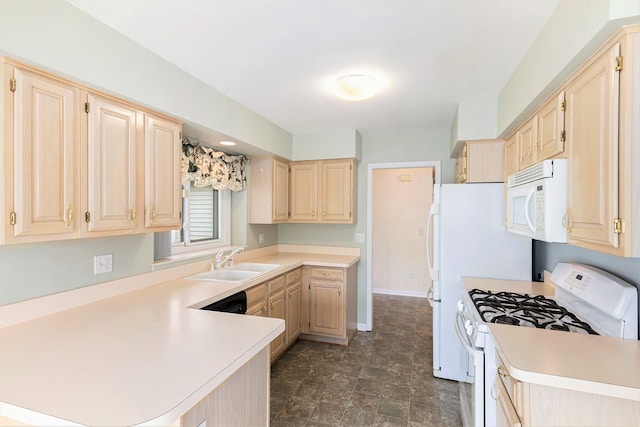 kitchen with a sink, light brown cabinets, and white appliances