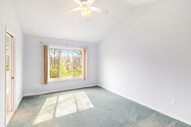 unfurnished room featuring baseboards, carpet flooring, a ceiling fan, and lofted ceiling