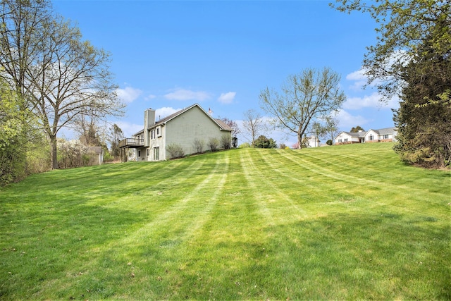 view of yard featuring a wooden deck