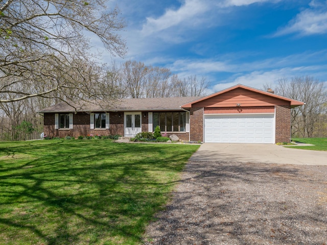 ranch-style home featuring brick siding, an attached garage, and driveway