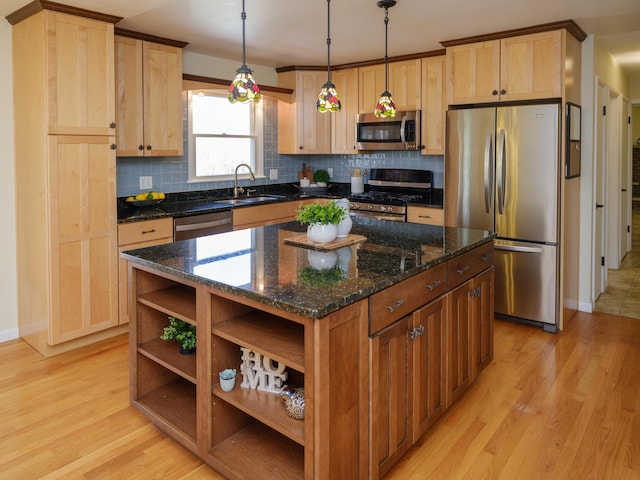 kitchen featuring decorative backsplash, appliances with stainless steel finishes, open shelves, a sink, and light wood finished floors