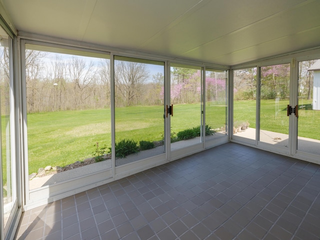 unfurnished sunroom with a wealth of natural light