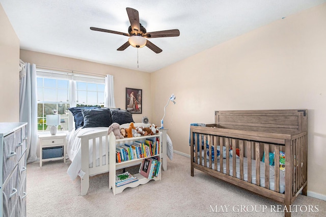 bedroom featuring carpet floors, a ceiling fan, and baseboards