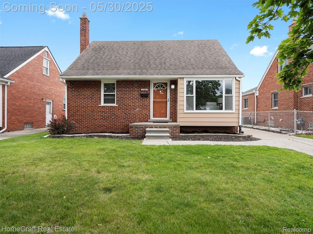17489 Brody Ave, Allen Park, MI 48101 - view of front of home with a chimney, roof with shingles, and brick siding