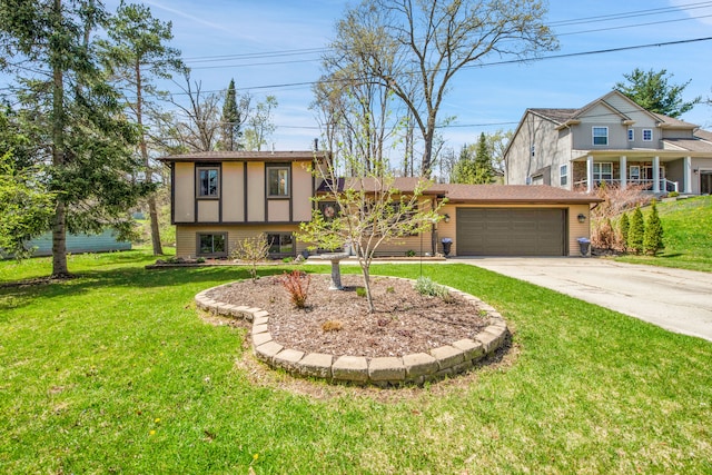 split level home with a garage, driveway, and a front yard
