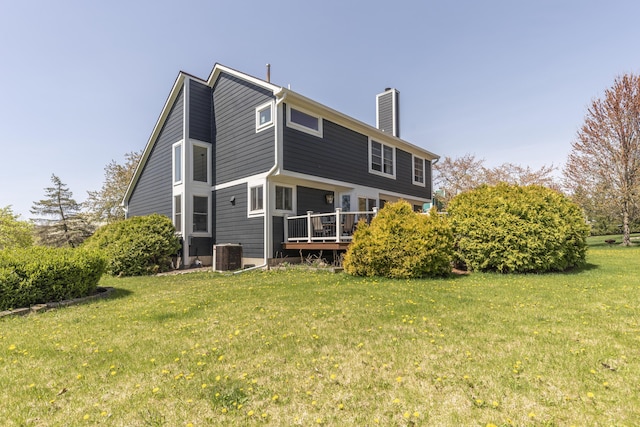 3941 Steamboat Ct, Ann Arbor, MI 48108 - rear view of house with central air condition unit, a chimney, a yard, and a deck