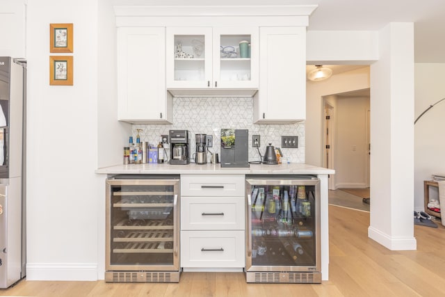 3941 Steamboat Ct, Ann Arbor, MI 48108 - bar featuring backsplash, light wood finished floors, and wine cooler