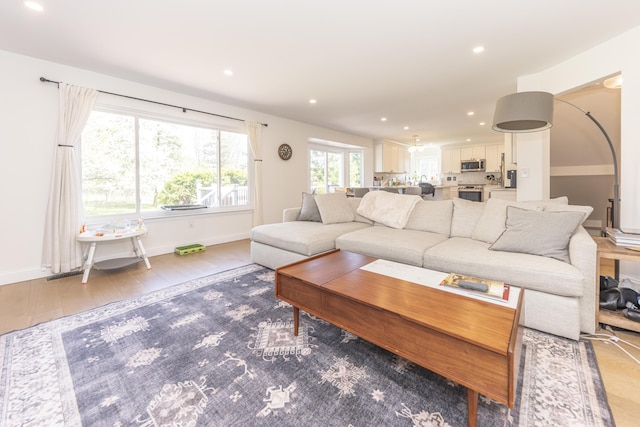 3941 Steamboat Ct, Ann Arbor, MI 48108 - living room featuring recessed lighting, baseboards, wood finished floors, and visible vents