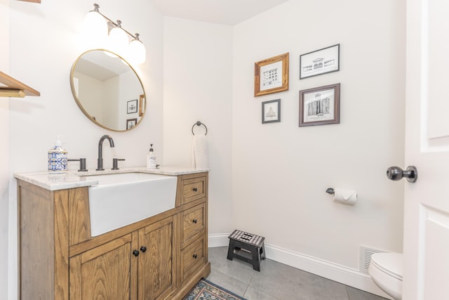 3941 Steamboat Ct, Ann Arbor, MI 48108 - half bath featuring toilet, tile patterned floors, visible vents, and baseboards