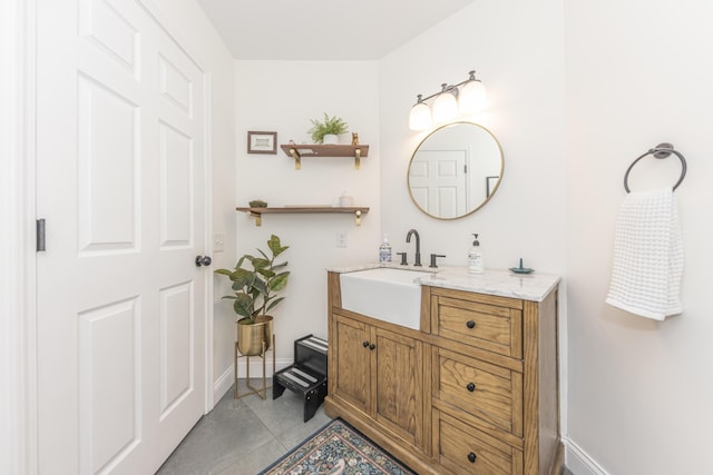 3941 Steamboat Ct, Ann Arbor, MI 48108 - bathroom featuring baseboards, tile patterned flooring, and vanity