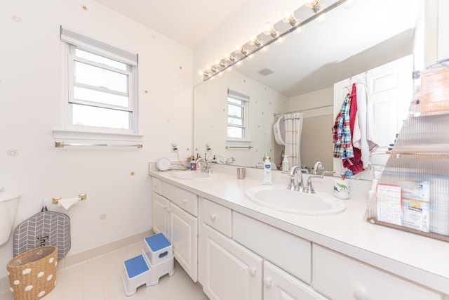 3941 Steamboat Ct, Ann Arbor, MI 48108 - full bathroom with double vanity, tile patterned floors, and a sink