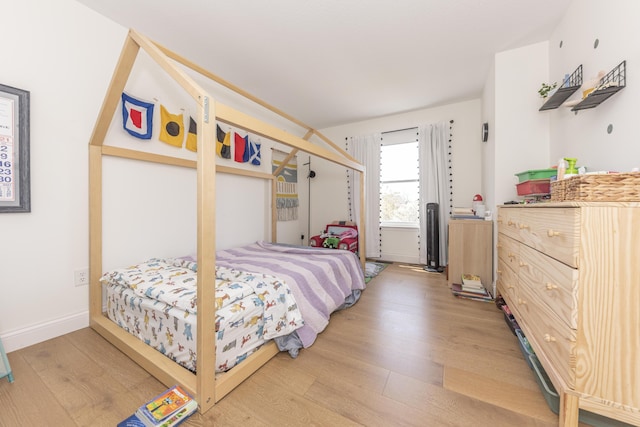 3941 Steamboat Ct, Ann Arbor, MI 48108 - bedroom featuring baseboards and wood finished floors