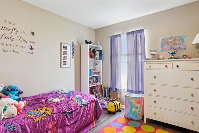 bedroom featuring wood finished floors