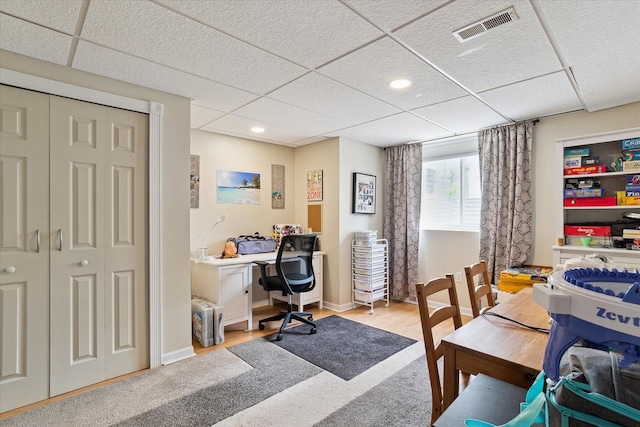 office area with recessed lighting, visible vents, and a drop ceiling