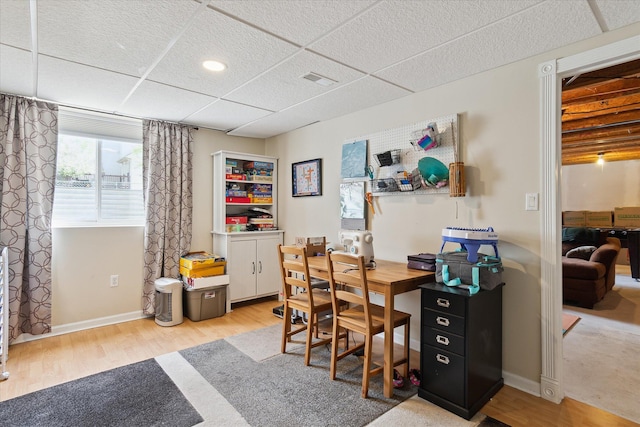 office area with baseboards and wood finished floors