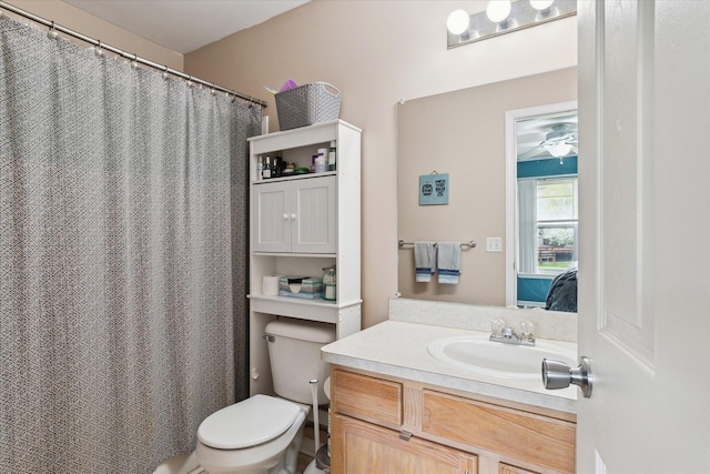 full bathroom with vanity, a ceiling fan, and toilet