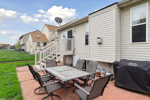 view of patio / terrace featuring fence, grilling area, and outdoor dining space
