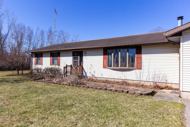 single story home featuring a front yard