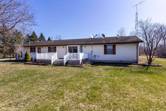 view of front of house featuring crawl space, a deck, and a front lawn