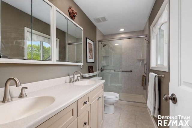 full bath featuring a sink, toilet, and a shower stall
