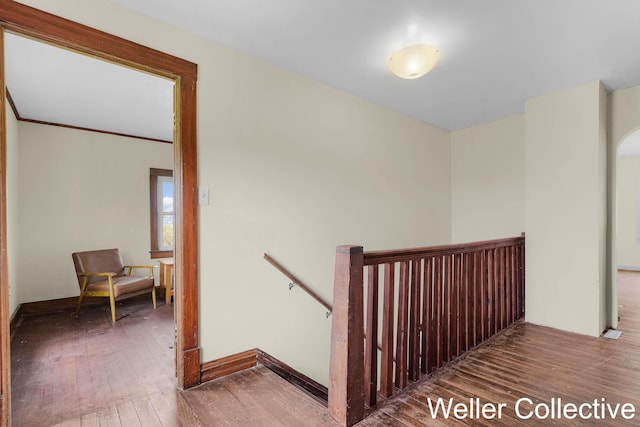 stairway featuring hardwood / wood-style floors