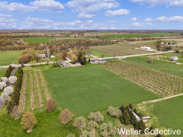 birds eye view of property featuring a rural view