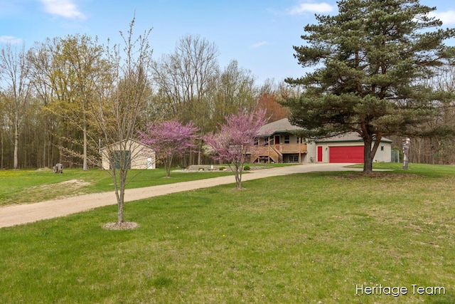 view of front of house with driveway and a front yard