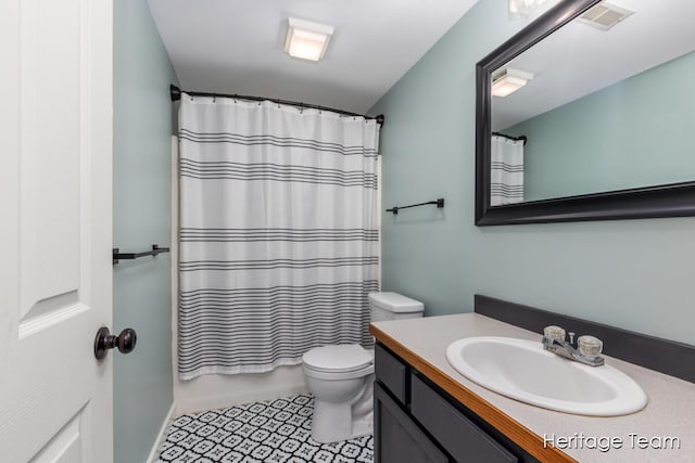 full bathroom with visible vents, shower / tub combo, vanity, tile patterned floors, and toilet