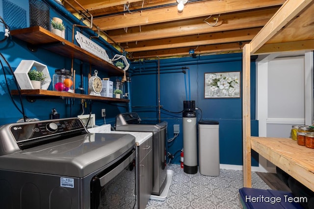 laundry room featuring washing machine and clothes dryer