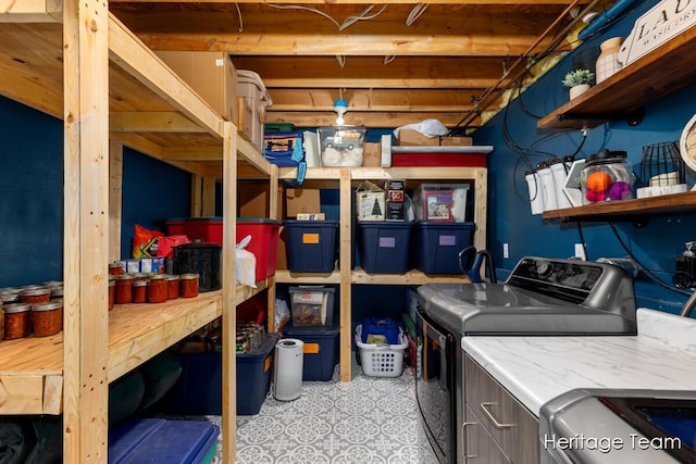 storage area featuring washing machine and dryer
