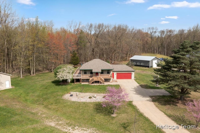 birds eye view of property featuring a view of trees