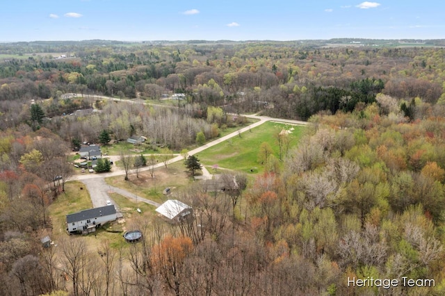 drone / aerial view featuring a view of trees