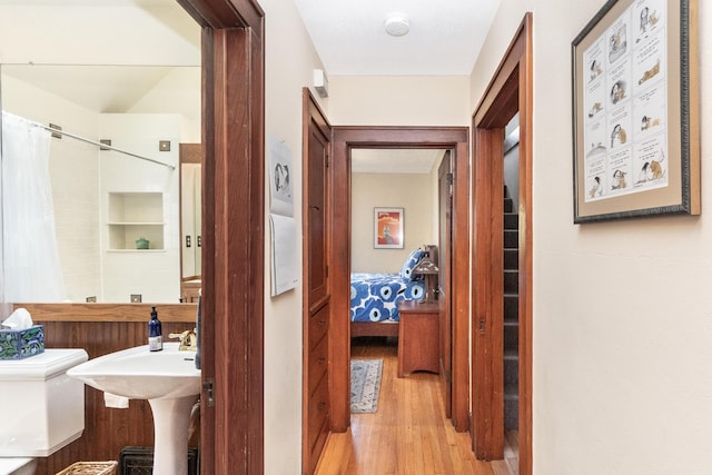 corridor featuring wood finished floors